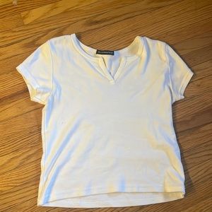 white brandy melville t shirt with a stain